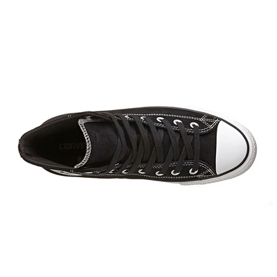 Black and white Converse Chuck Taylor All Star Suede shoes with classic design and white rubber soles.