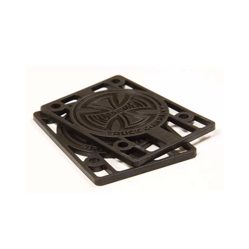 Independent skateboard risers in various sizes, shown in black, designed to elevate skateboard decks for improved performance.