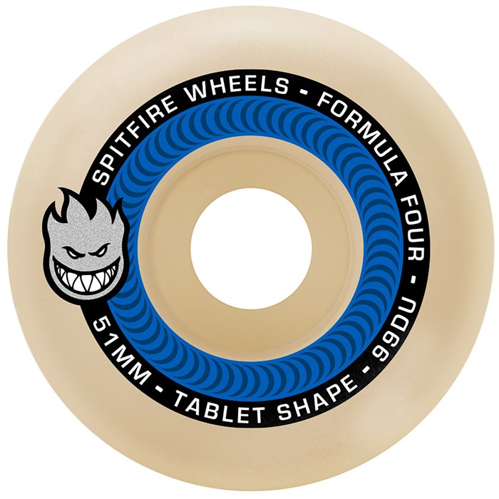 Spitfire Formula Four 99D skateboard wheels with yellow tablets, showcasing their durable urethane construction and smooth rolling design.